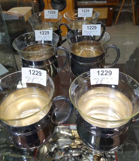 6 tea cups with glass insert in a metal holder