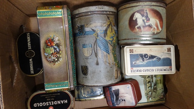 2 boxes of advertising tins